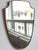Mid-century italian wall mirror with brass frame (circa 1960s). This mirror is simply elegant and characterful in a...