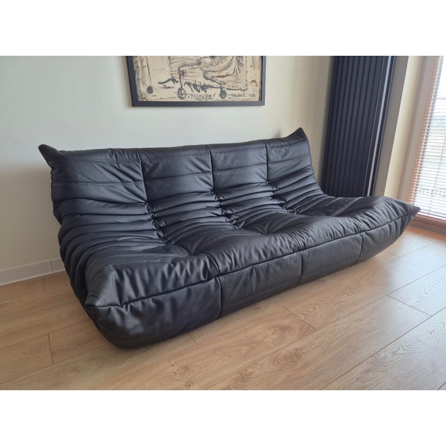 Togo Sofa in Black Leather by Michel Ducaroy for Ligne Roset, in Flawless conditions. Designed 1970 to 1979 This piece has...