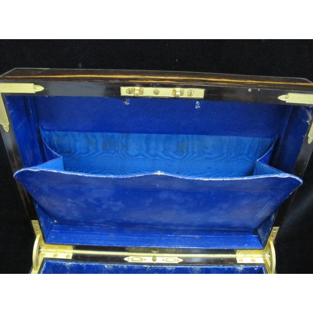 Victorian era coromandel wood travel box. Lid opens to a removable tray with 6 compartments lined in bright blue velvet....