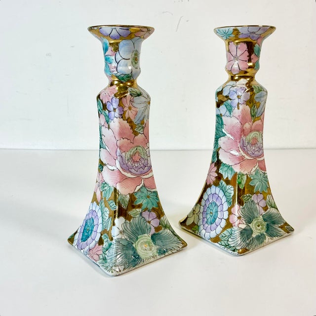 Beautiful hand painted Chinoiserie flora botanical Candleholders from the 1980s. They feature a large pink peony in the...