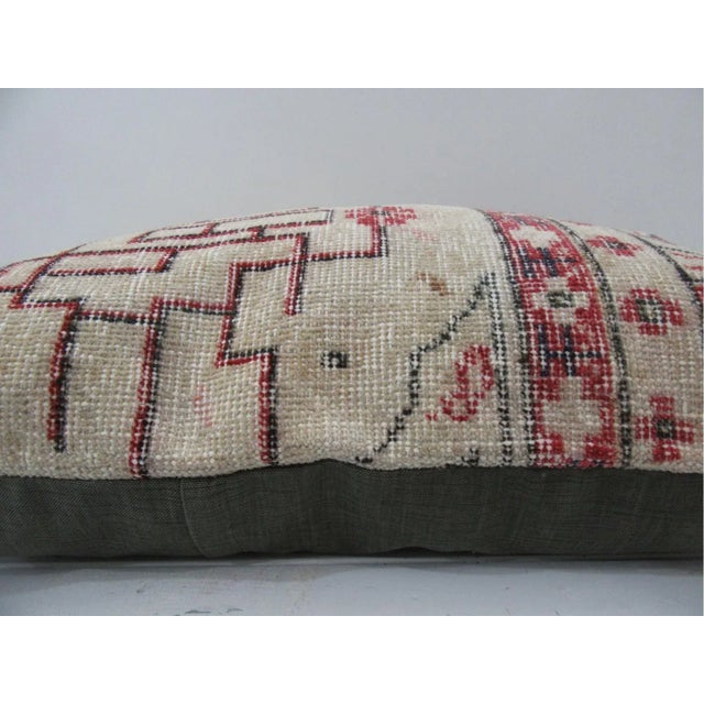 This is a pillow cover made from a vintage kilim rug. The piece was properly washed and ready to use. Pillow inserts not...