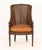 American Regency Style Floral Carved Mahogany Cane Paneled Bergere, with woven leather cushion on four tapered legs....
