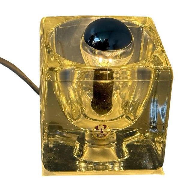 Vintage lamp made from a glass cube housing an e14 socket. made by Peill & Putzler and is marked with a sticker. In good...