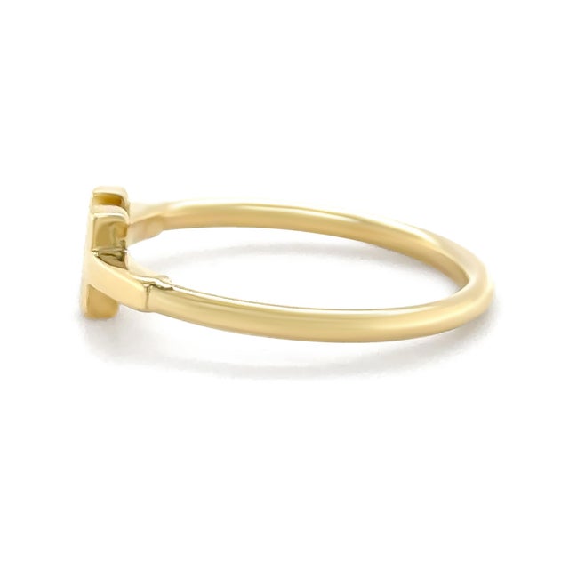 A contemporary Tiffany & Co. T Wire ring crafted in 18ct yellow gold, showcasing the brand’s iconic minimalist design...