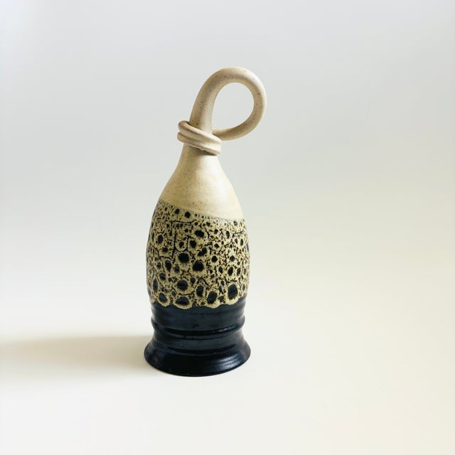 A vintage studio pottery drinking horn. Made by King's Stoneware and named "the orgy cup", a novelty drinking cup that you...