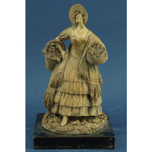 Wonderful terracotta sculpture entirely modeled by hand, without a mold, depicting a lady in eighteenth-century clothes,...