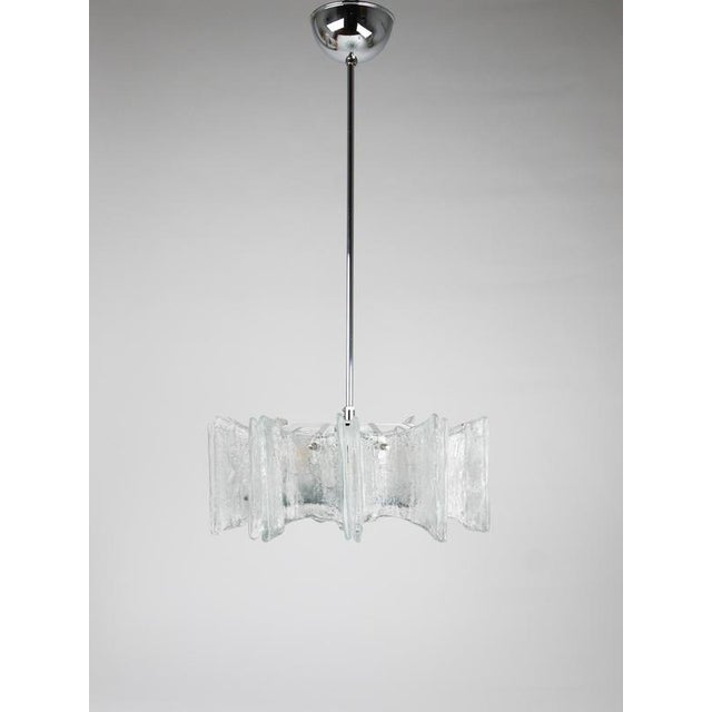A beautiful mid-century modern, star-shaped chandelier / ceiling light fixture, designed and manufactured by j.t. Kalmar,...