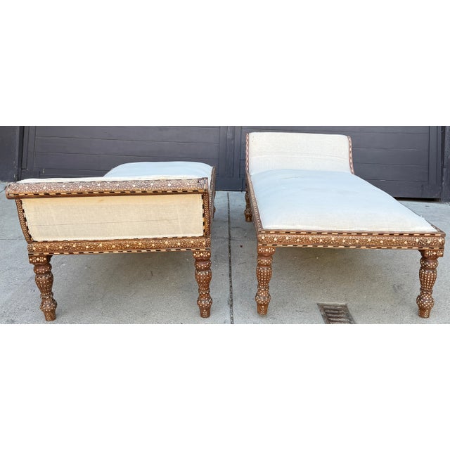 An extraordinary pair of Levantine-style bone-inlay daybeds featuring richly detailed floral marquetry, elegant scrolling...