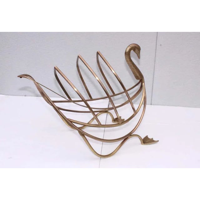 1960s solid brass swan magazine holder by Maison Jansen, in vintage condition lightly hand polished.