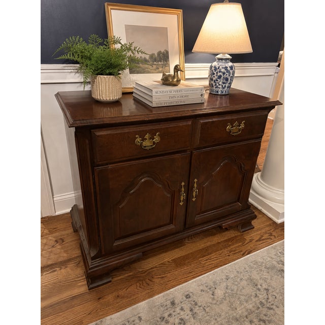 Perfect for someone who loves traditional American furniture. Beautiful solid wood cabinet with a cherry finish by Keller...
