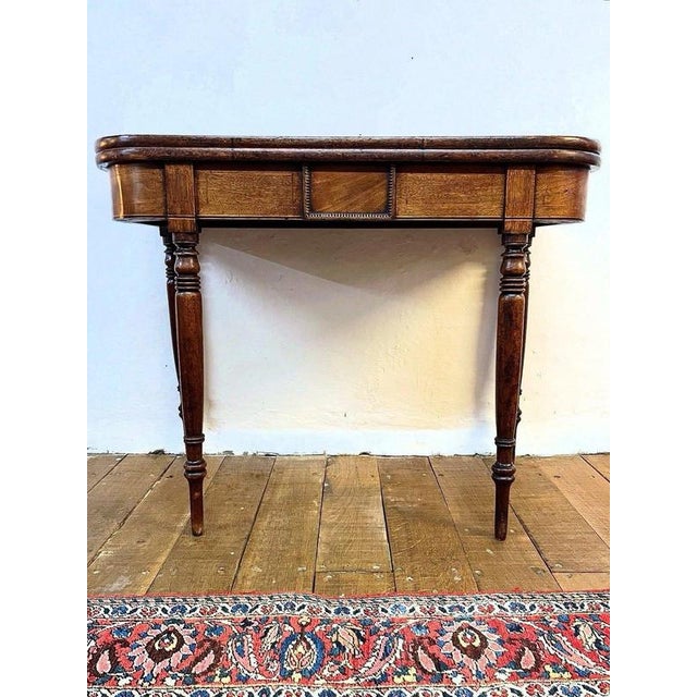 George iii mahogany fold-top tea table, circa 1800 material: mahogany, inlaid wood a refined george iii mahogany fold-top...