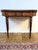 George iii mahogany fold-top tea table, circa 1800 material: mahogany, inlaid wood a refined george iii mahogany fold-top...
