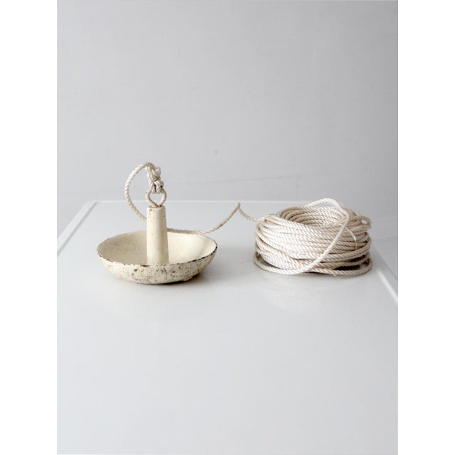 Heavy vintage cast iron mushroom boat anchor dating to the 1950s–1970s with approximately 106 feet of rope attached. This...