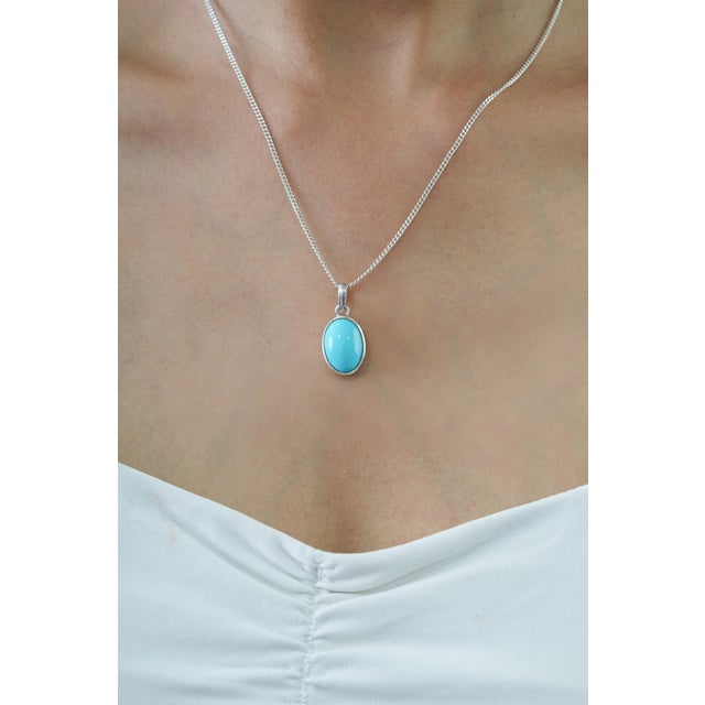 The Vibrant 4.7 Ct Natural Turquoise Bezel Set 925 Silver Pendant for Her features a beautiful 4.7-carat natural turquoise...