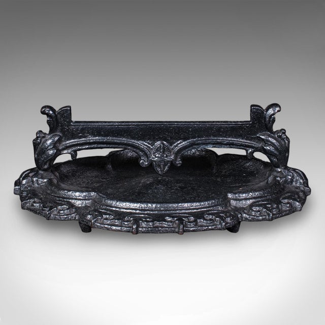 This is an antique entrance boot scraper. An English, cast iron doorway shoe cleaner and pull, dating to the late...