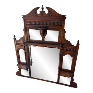 Antique Victorian or Eastlake-Style Carved Wood Overmantel Mirror Featuring Multiple Bevelled Glass Panels and Display Shelves For Sale