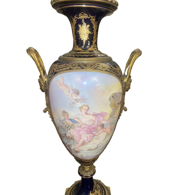 An exceptional pair of 19th century French Sèvres porcelain urns, richly decorated with finely hand-painted mythological...