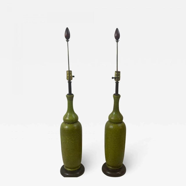 Great Pair Of Olive Green Bottle Shaped Pottery Lamps with Brown Enamel Metal Bases and Wood Finials. Designed In The...