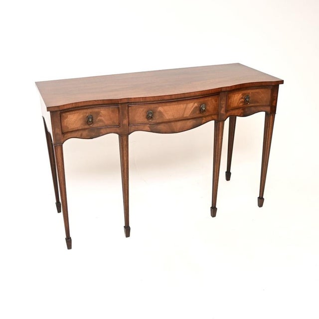 An outstanding antique Georgian style inlaid console table, made in England and dating from around the 1930’s. This is of...