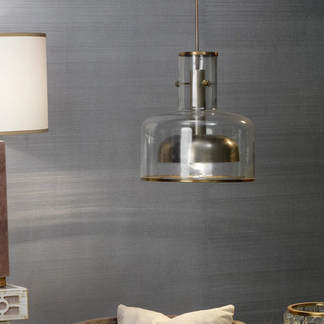 Modern Loft style metal and glass pendant with an unique conception of glass shade over metal. Professional Installation...