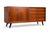 A compact 160 cm Danish teak sideboard from the 1960s with sliding doors and drawers. The diagonally tapered legs maintain...