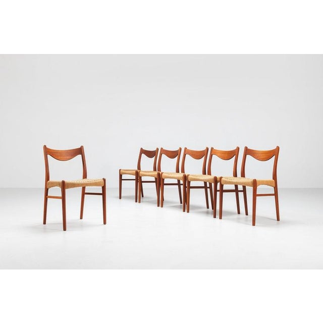 A refined set of six dining chairs designed by Arne Wahl Iversen and produced by Glyngøre Stolefabrik in Denmark during...