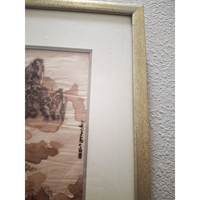 A contemplative ink wash landscape attributed to Chinese artist Yang Yang, purchased in 1989 from the Harvard Coop in...