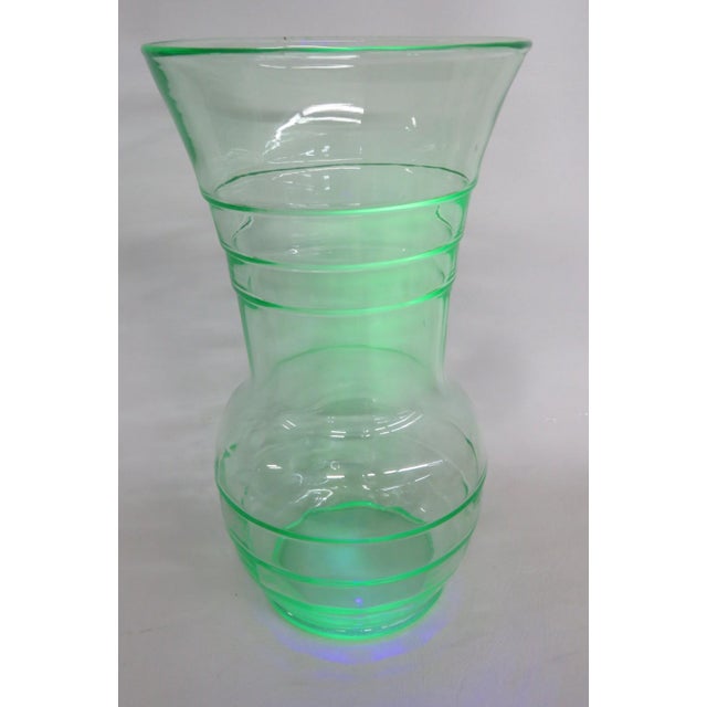 This beautiful Large Flared Vase is made out of vaseline/uranium glass. This stunning vase is a beautiful green color all...
