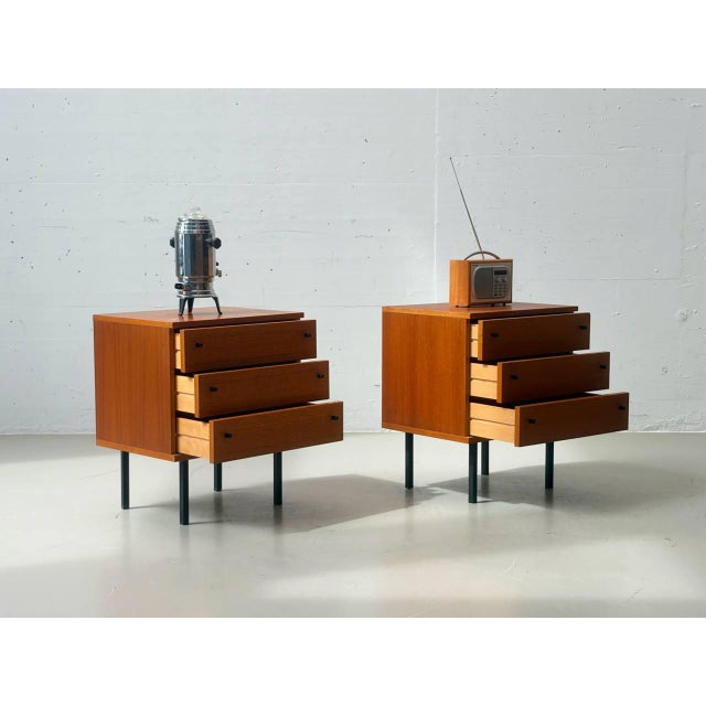 This stylish pair of bedside tables was designed in the 1960s by günter renkel for rego möbel and belongs to the renowned...