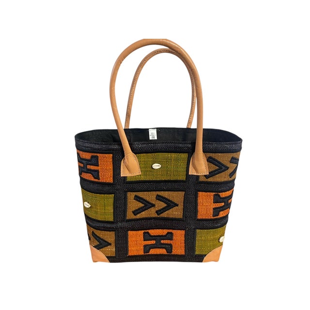 This hand made Sewn and Embroidered Raffia /leather Tote Bag from Madagascar showcases traditional raffia weaving with...