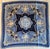 Elegant Escada silk scarf featuring a sophisticated blue gradient background and ornate white baroque scrollwork