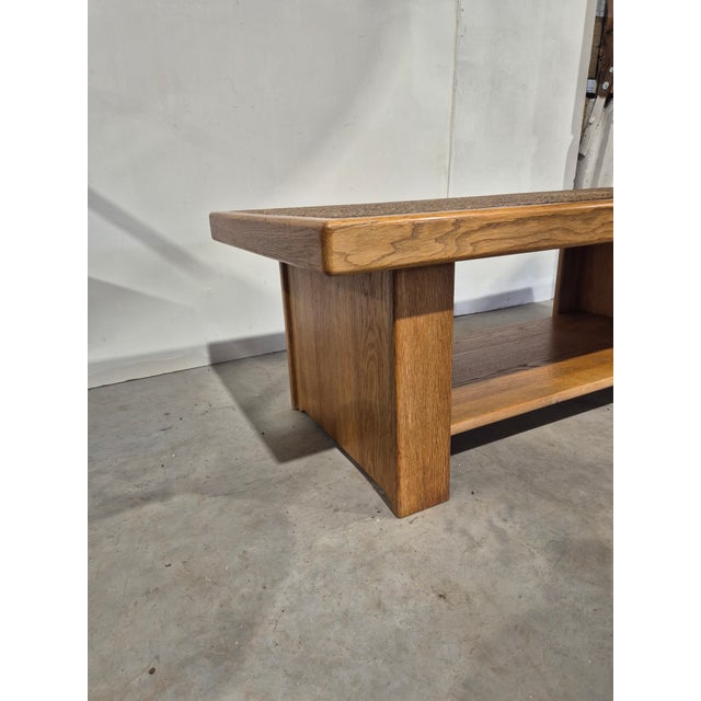 Beautiful table with a high quality oak frame. The table top is made of small pebbles. A unique table with a high quality