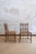 Faux bamboo and vienna straw dining set – 1970s comprising a rectangular dining table and six matching chairs. Turned wood...