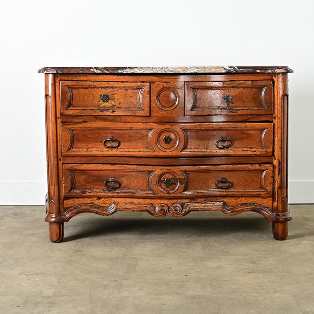 A spellbinding Louis XV period walnut commode, second half of the 18th century, from the Pyrenees region of France. A...