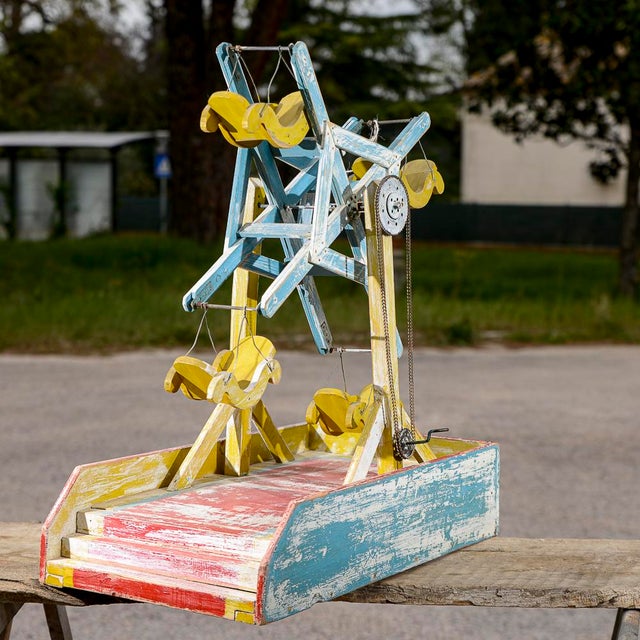 Wooden carousel toy with chain mechanism made of lacquered wood made in 1900. Measurements 62 x33 x h 72 category toys...