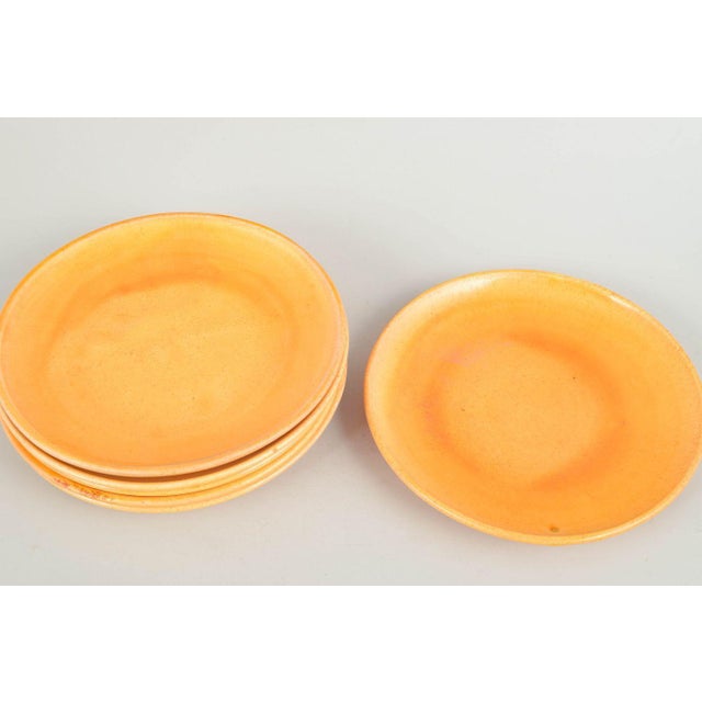 Kähler, set of six plates. Six ceramic plates with uranium glaze in warm golden tones, produced by Kähler in the 1930s....