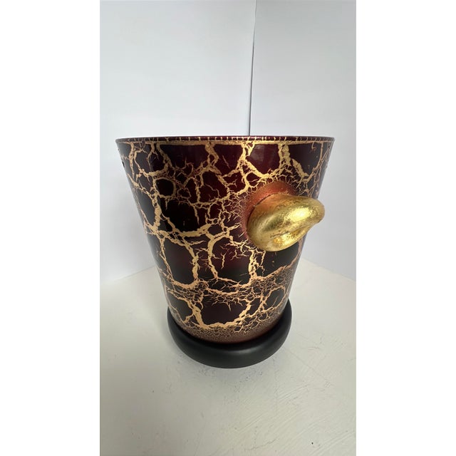 This striking vintage wine red and gold splatter ice bucket captures the bold glamour of mid-century Italian barware. The...