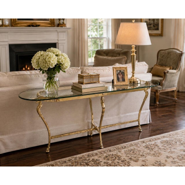Elevate your space with this exceptional Mid-Century Modern Hollywood Regency tri-corner guéridon side table. Masterfully...