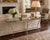 Elevate your space with this exceptional Mid-Century Modern Hollywood Regency tri-corner guéridon side table. Masterfully...
