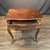 Very early French Louis XV walnut side table featuring a shaped top above a single drawer, raised on graceful cabriole...