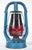 Vintage kerosene lanterns made of a factory blue painted steel body and ruby red glass globes. Both were made by R.E....