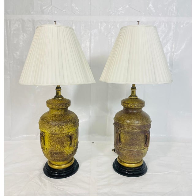 A striking pair of vintage ceramic table lamps designed and manufactured in the United States by Frederick Cooper,...
