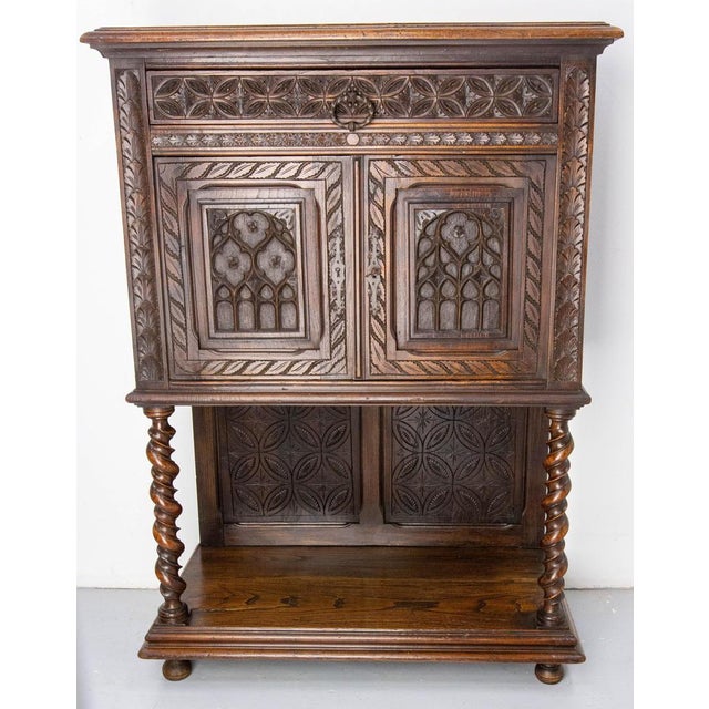 French chestnut sideboard buffet in the neogothic style. Turned legs gothic and geometrical motifs. One drawer and two...
