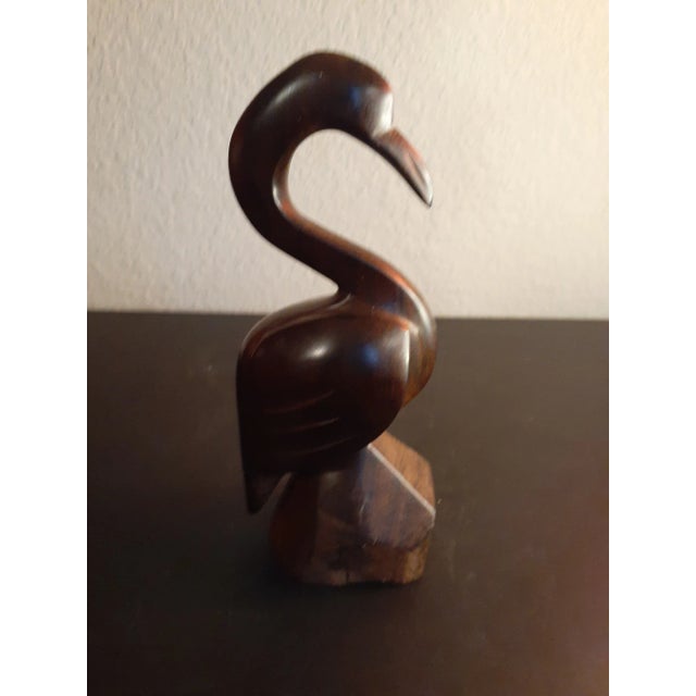 This is a Handcarved Iron Wood 7" Stork Figurine. Procured at auction BOX C