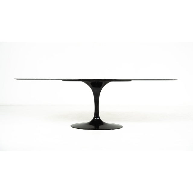 Tulip Dining Table by Eero Saarinen for Knoll, Black Marble, 1960s This piece is attributed to the mentioned...