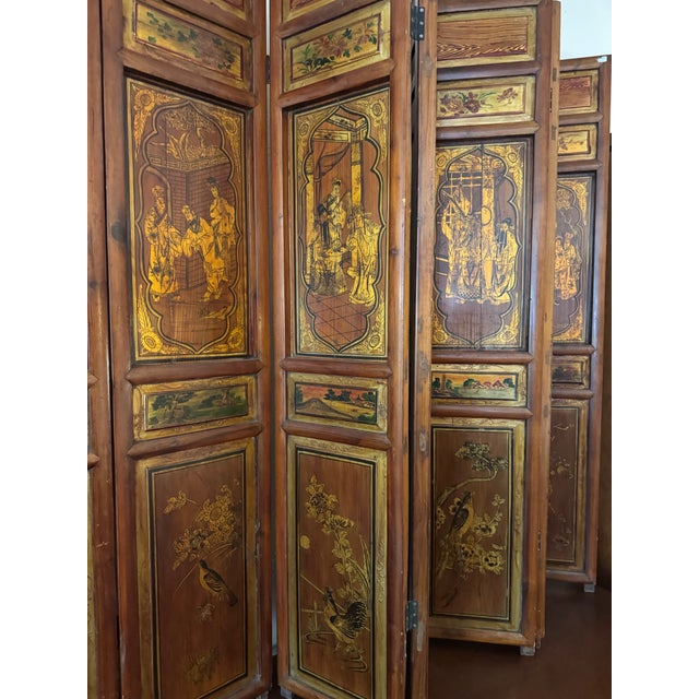 A beautifully detailed vintage seven-panel tabletop chinoiserie folding screen, perfectly scaled for display atop a...