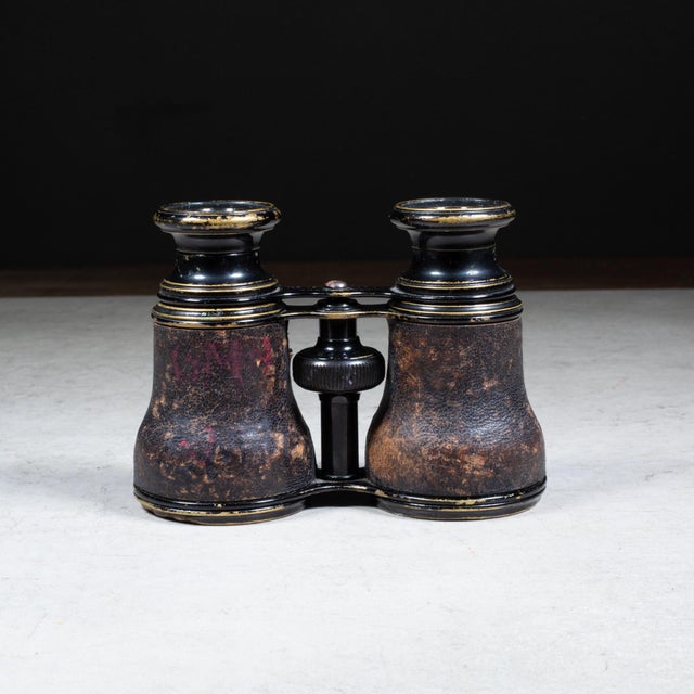 ABOUT An original pair of leather wrapped and brass opera binoculars. Stamped "12 Verres Supérieurs" on the metal bridge.....