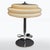 A refined Art Deco table lamp with a classic chrome structure and a distinctive yellow-toned glass shade. The elegant...