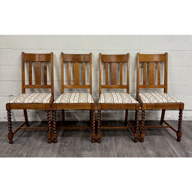 This is a gorgeous set of four vintage English style barley twist tiger oak pub dining chairs, believed to be from around...