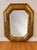 An exceptional large-scale vintage Chinoiserie Asian-style octagonal wall mirror featuring an elegant gilt-finished...